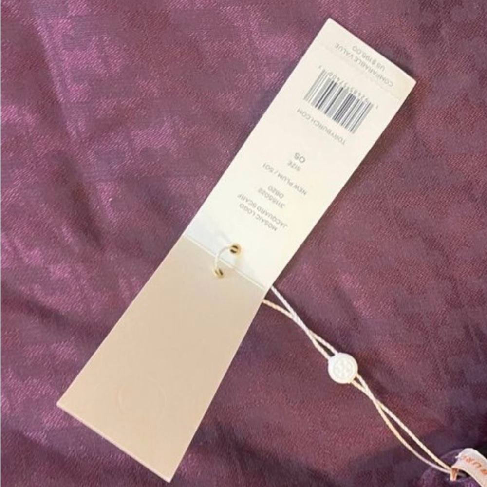 Tory Burch plum purple scarf with monogram print.  Brand new with tags